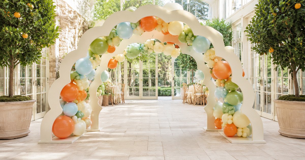Elegant Creators citrus scallop balloon portal installation