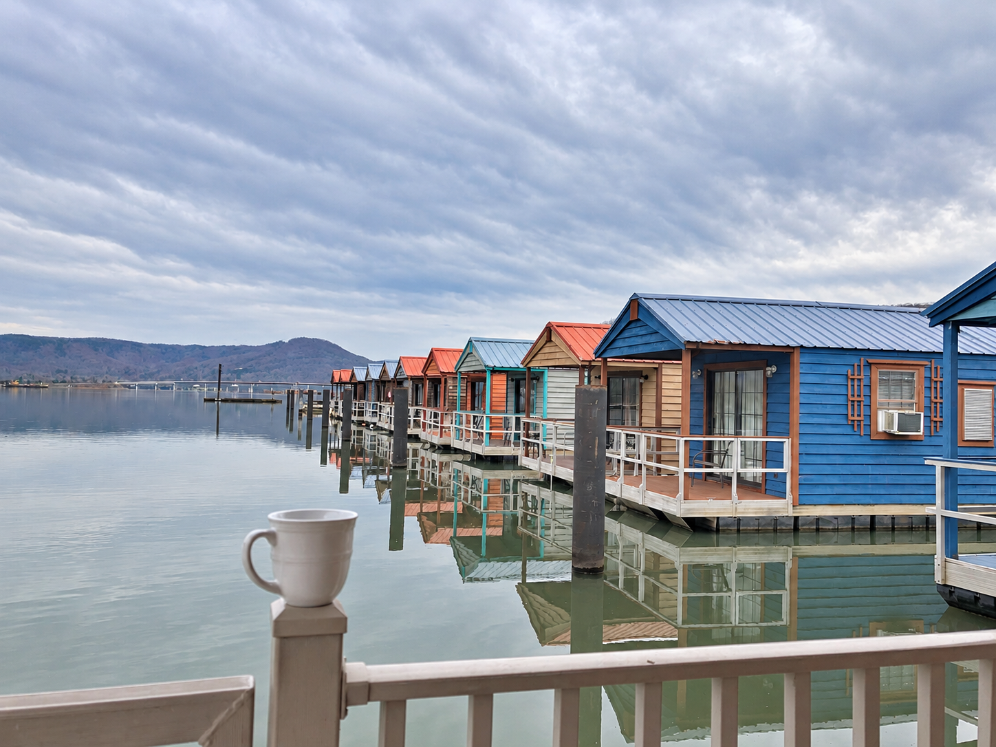 Colorful floating cabins and lake reflections at Hales Bar Marina in Tennessee