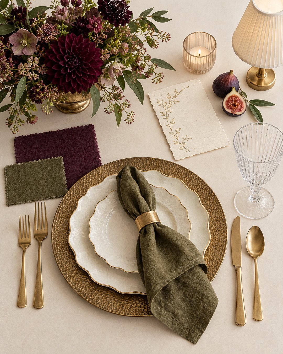 Plum, olive, ivory and antique-gold wedding table materials arranged for a Canva mockup